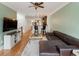 Open-concept living room featuring hardwood floors, neutral walls, and a ceiling fan at 5523 Glenridge Ne Park, Atlanta, GA 30342