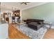 Spacious living room with hardwood floors, a ceiling fan, and views into the kitchen at 5523 Glenridge Ne Park, Atlanta, GA 30342