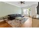 Bright living room with hardwood floors, large windows, a plush rug, a large television, and neutral walls at 5523 Glenridge Ne Park, Atlanta, GA 30342