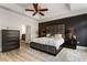 Spacious main bedroom with ceiling fan, neutral walls, and dark wood furniture at 5523 Glenridge Ne Park, Atlanta, GA 30342
