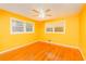 Sunny bedroom with two large windows and hardwood floors at 698 N Superior Ave, Decatur, GA 30033
