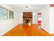 Cozy living room features a brick fireplace and white-painted bead board at 698 N Superior Ave, Decatur, GA 30033