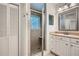 Bathroom with shower stall, granite vanity, framed mirror and closet at 751 Oneta Dr, Norcross, GA 30093