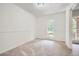Neutral bedroom with plush carpet, white walls, and natural light at 751 Oneta Dr, Norcross, GA 30093
