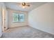 Neutral bedroom with a ceiling fan and a window at 751 Oneta Dr, Norcross, GA 30093
