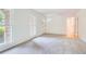 Living room with neutral carpet, white walls, and natural light at 751 Oneta Dr, Norcross, GA 30093