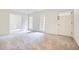 Bright living room featuring new carpet and fresh paint at 751 Oneta Dr, Norcross, GA 30093
