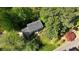 Aerial view of the home showcasing its beautiful surroundings with mature trees and well-maintained landscaping at 1569 Chateau Dr, Dunwoody, GA 30338