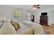 Bedroom with hardwood floors, a ceiling fan, an area rug and an ensuite bathroom at 1569 Chateau Dr, Dunwoody, GA 30338