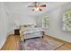Neutral bedroom with hardwood floors, soft lighting, and large windows for natural light at 1569 Chateau Dr, Dunwoody, GA 30338
