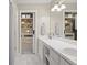 Bright bathroom with double sink and walk-in closet at 1711 Taynton Cir, Kennesaw, GA 30152
