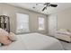 Bedroom featuring a ceiling fan and natural light through bright windows at 1711 Taynton Cir, Kennesaw, GA 30152