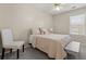 Cozy bedroom showcasing neutral tones, natural light, and modern furnishings at 1711 Taynton Cir, Kennesaw, GA 30152