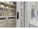 Detailed view of custom closet shelving and cabinetry at 1711 Taynton Cir, Kennesaw, GA 30152