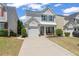 Charming two-story home with a well-maintained lawn, a driveway and front porch with great curb appeal at 1711 Taynton Cir, Kennesaw, GA 30152