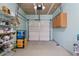 Well-organized garage with storage shelves, cabinets, and clean flooring at 1711 Taynton Cir, Kennesaw, GA 30152