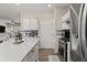Bright kitchen features quartz countertops, stainless steel appliances, and decorative tile backsplash at 1711 Taynton Cir, Kennesaw, GA 30152
