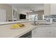 Kitchen sink and counter with a view to the living room with fireplace and TV at 1711 Taynton Cir, Kennesaw, GA 30152