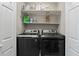 Convenient laundry room featuring modern washer and dryer units at 1711 Taynton Cir, Kennesaw, GA 30152