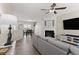 Open-concept living room flows into the dining area, featuring a fireplace, a sectional couch, and a television at 1711 Taynton Cir, Kennesaw, GA 30152