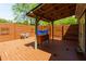 Covered deck with privacy fence and outdoor lighting provides an ideal entertainment space at 2673 Rainbow Forest Dr, Decatur, GA 30034