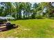 Expansive, well-maintained backyard with mature trees, patio, and plenty of space for recreation at 2673 Rainbow Forest Dr, Decatur, GA 30034