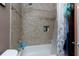 Bathroom featuring tiled shower with hand-held shower head and built-in shelving niche at 2673 Rainbow Forest Dr, Decatur, GA 30034