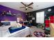 Colorful bedroom with a ceiling fan, and a window with shutters at 2673 Rainbow Forest Dr, Decatur, GA 30034