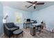 Bedroom showcasing a modern desk, large window with shutters, and plush carpeting at 2673 Rainbow Forest Dr, Decatur, GA 30034