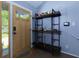 Bright entryway featuring a wooden door with glass, shelf, and rainbow rug at 2673 Rainbow Forest Dr, Decatur, GA 30034