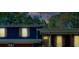 Exterior view of home with red brick and blue wood paneled walls at twilight at 2673 Rainbow Forest Dr, Decatur, GA 30034