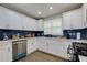 Bright kitchen featuring modern appliances, sleek countertops, and blue backsplash at 2673 Rainbow Forest Dr, Decatur, GA 30034