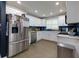 Modern kitchen with stainless steel appliances and blue backsplash at 2673 Rainbow Forest Dr, Decatur, GA 30034