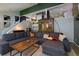 Inviting living room features a large gray sectional, wood floors, modern decor, and plenty of natural light at 2673 Rainbow Forest Dr, Decatur, GA 30034