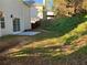 Backyard with a concrete patio and a small, grassy hill at 4018 Dorchester Nw Walk, Kennesaw, GA 30144