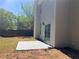 Backyard with a small concrete patio and newly seeded grass at 4018 Dorchester Nw Walk, Kennesaw, GA 30144