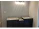 Bathroom featuring double sink vanities and a granite countertop at 4018 Dorchester Nw Walk, Kennesaw, GA 30144
