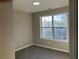 Carpeted bedroom with neutral walls and bright window at 4018 Dorchester Nw Walk, Kennesaw, GA 30144