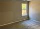 Bedroom with neutral carpet and window at 4018 Dorchester Nw Walk, Kennesaw, GA 30144