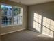 Bedroom with neutral carpet, natural light, and window at 4018 Dorchester Nw Walk, Kennesaw, GA 30144