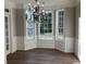Dining area with decorative chandelier and a bay window for ample natural light at 4018 Dorchester Nw Walk, Kennesaw, GA 30144