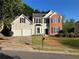 Two-story home with brick and siding, a two-car garage, and a well-manicured lawn at 4018 Dorchester Nw Walk, Kennesaw, GA 30144