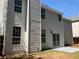 Two-story house with white siding, a patio, and several large windows at 4018 Dorchester Nw Walk, Kennesaw, GA 30144