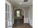 Elegant hallway with arched entryway and white trim at 4018 Dorchester Nw Walk, Kennesaw, GA 30144