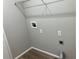 An empty laundry room with hookups and wire shelving at 4018 Dorchester Nw Walk, Kennesaw, GA 30144
