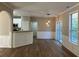 Living room with arched entrance, open concept to kitchen, and sliding door to the backyard at 4018 Dorchester Nw Walk, Kennesaw, GA 30144