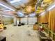 Unfinished basement space with exposed insulation and two garage doors at 25 Derby Dr, Hiram, GA 30141