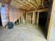 Unfinished basement area with exposed framing, perfect for customizing as living space at 25 Derby Dr, Hiram, GA 30141