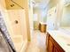 Well-lit bathroom featuring a bathtub, shower, and dual vanities, perfect for a functional and relaxing space at 25 Derby Dr, Hiram, GA 30141