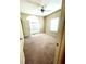 Spacious bedroom featuring a large arched window, ceiling fan and neutral decor at 25 Derby Dr, Hiram, GA 30141